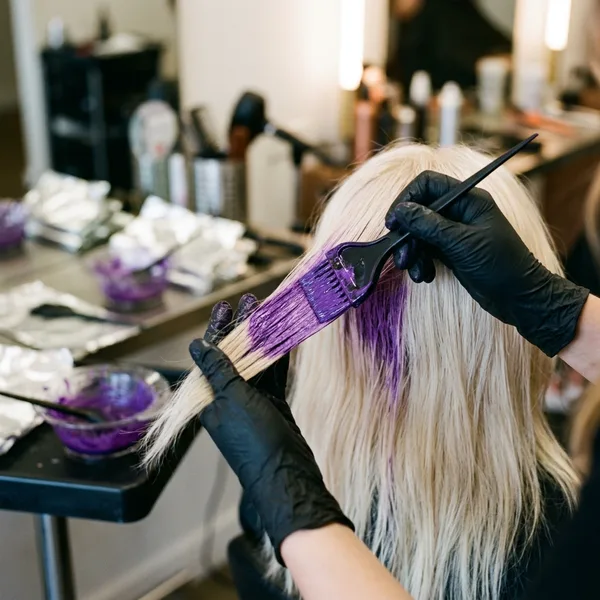 AI-generated social media post example: Staff Spotlights — created by Scribario from the prompt "Spotlight on Maria, our new colorist — 8 years experience, specializes in vivid fashion colors"